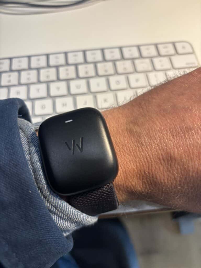Charging my whoop strap at my desk.